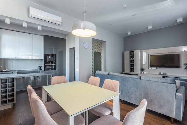 a kitchen and dining room with a table and other furniture